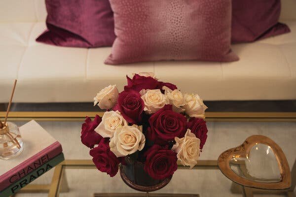 A vase filled with white and red roses