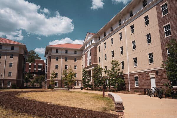 Brick dormitory buildings with tile roofs on a college campus